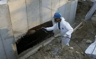 Professional waterproofing the exterior walls of the basement in Columbus, OH