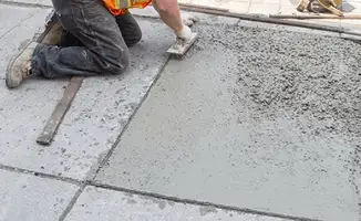 Professional repairing a concrete floor in Columbus, OH