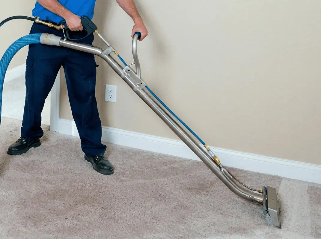 Professional operating a liquid removal machine on a carpeted floor in Columbus, OH